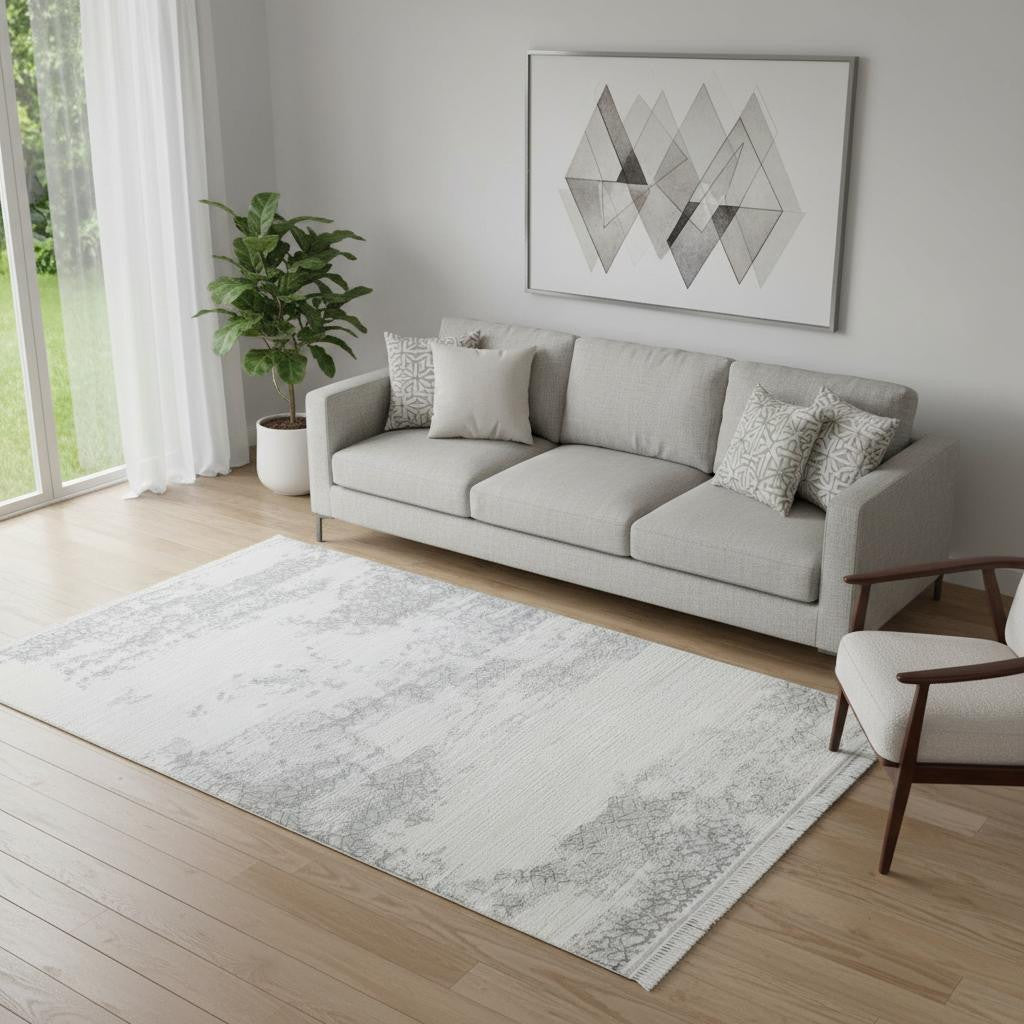 5' X 8' Gray And White Abstract Distressed Area Rug With Fringe